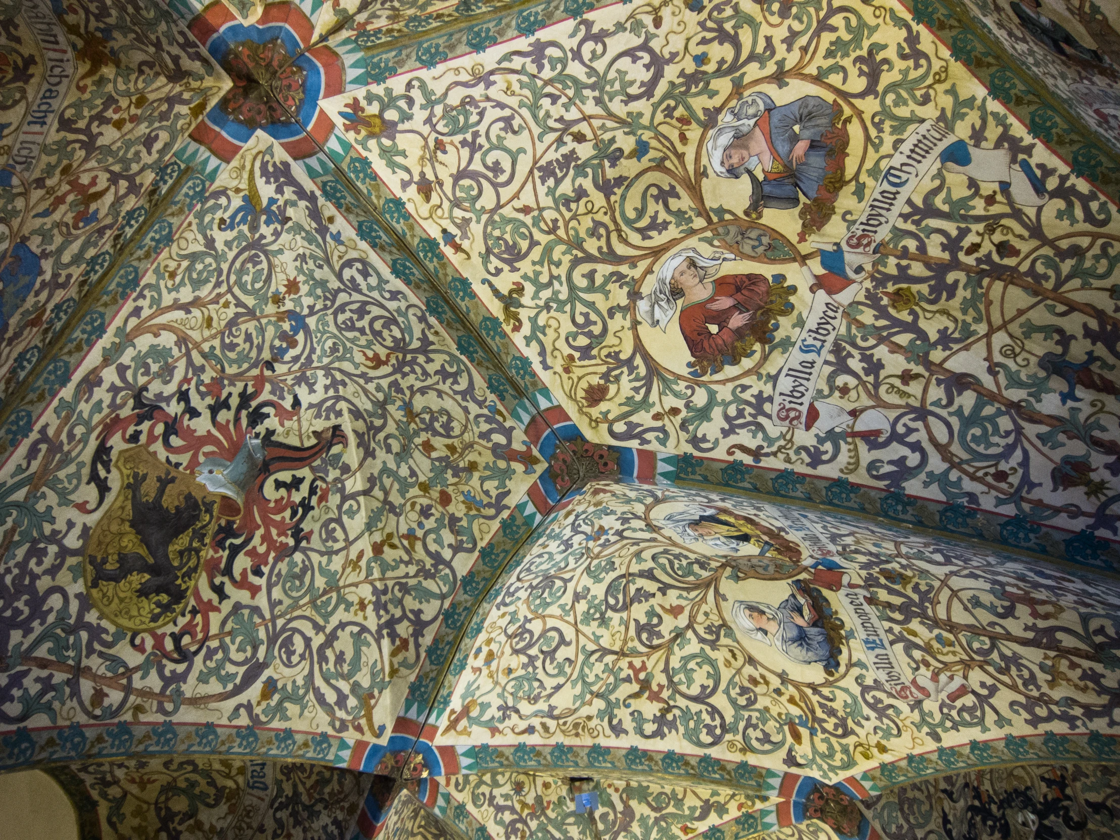 ceiling of a building decorated in ornate patterns