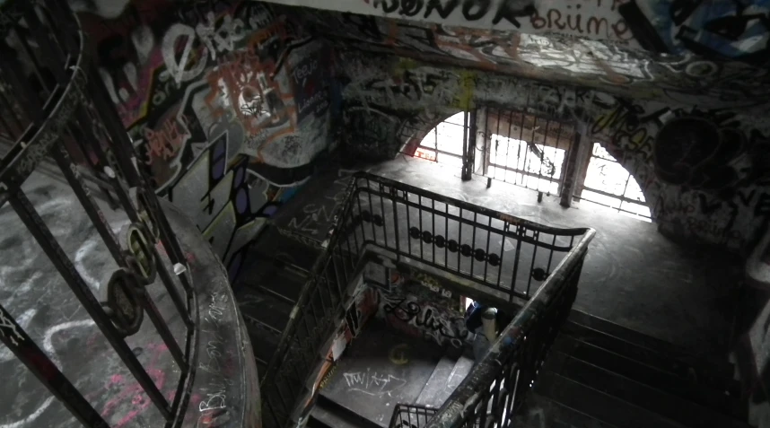 a staircase with graffiti on it is seen from above