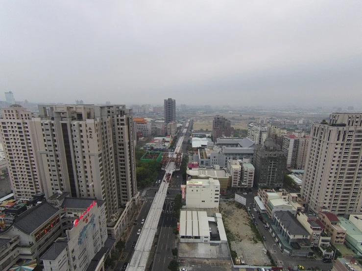 an aerial view of a city with tall buildings