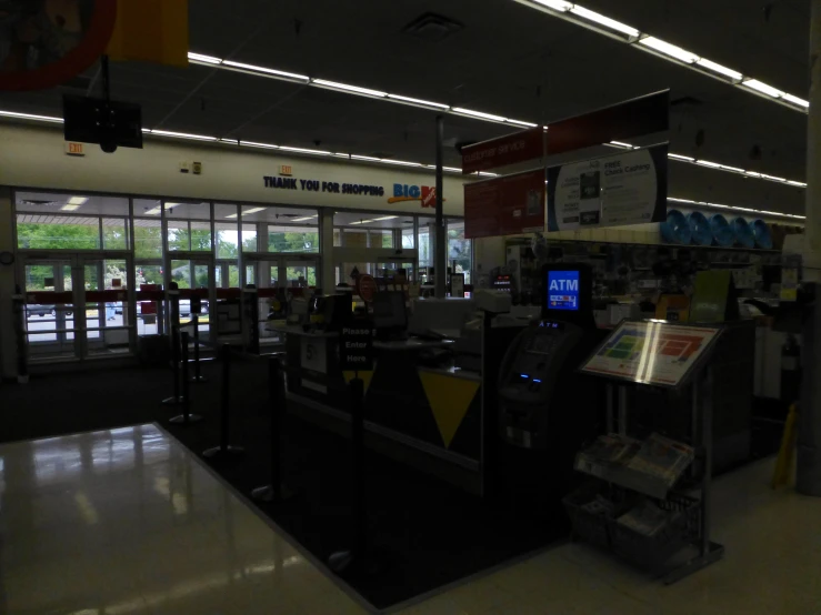 a store counter next to a cash machine