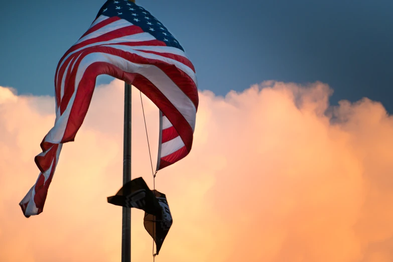 a large flag is being flown on a pole