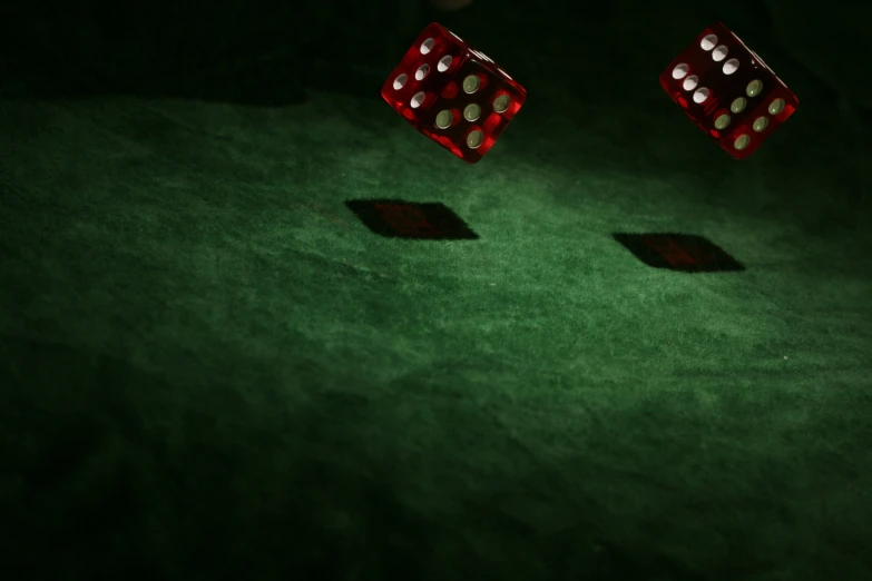 two dices that are standing up in the dark