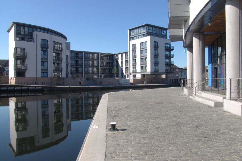 a building with a small lake next to it