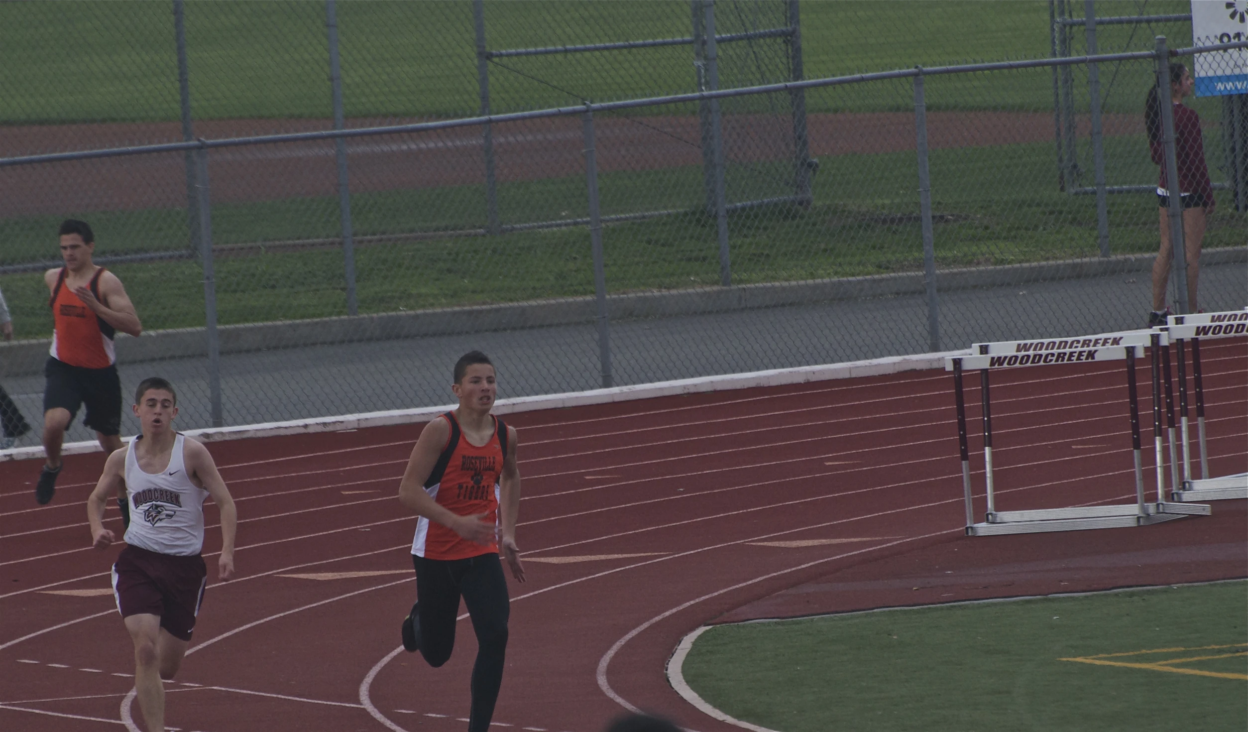 several men in running apparel in a race track