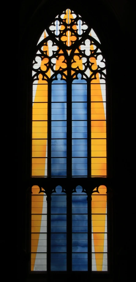 a window that has a stained glass window in it