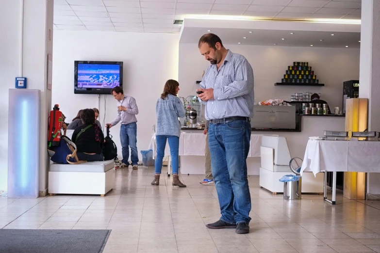 a man in a meeting room playing video games