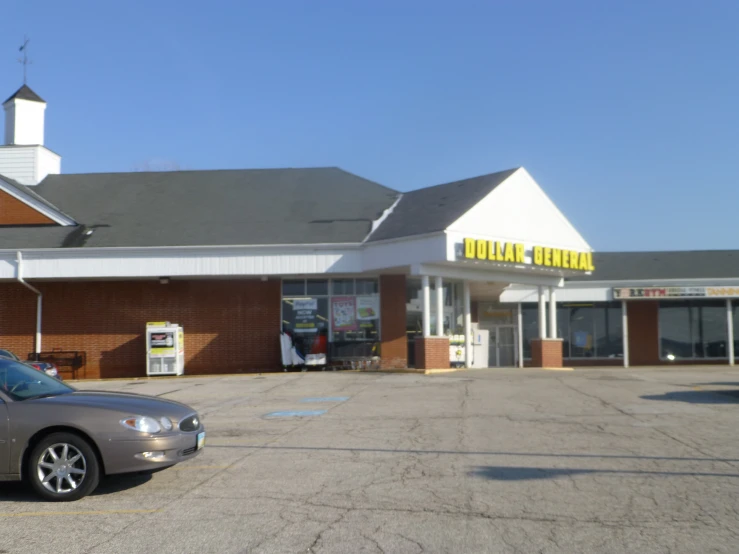 an old, abandoned dollar store, sitting on a vacant lot