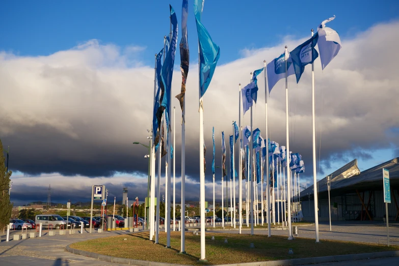 blue flags that are flying in the air