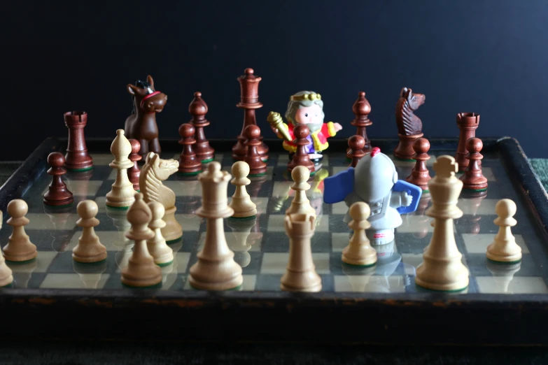 a small toy figure on a chess board