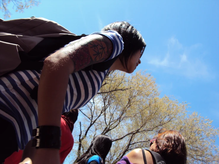 a person with his back turned to the camera wearing a backpack