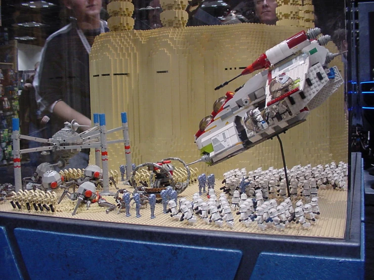 a display with many people and an action model