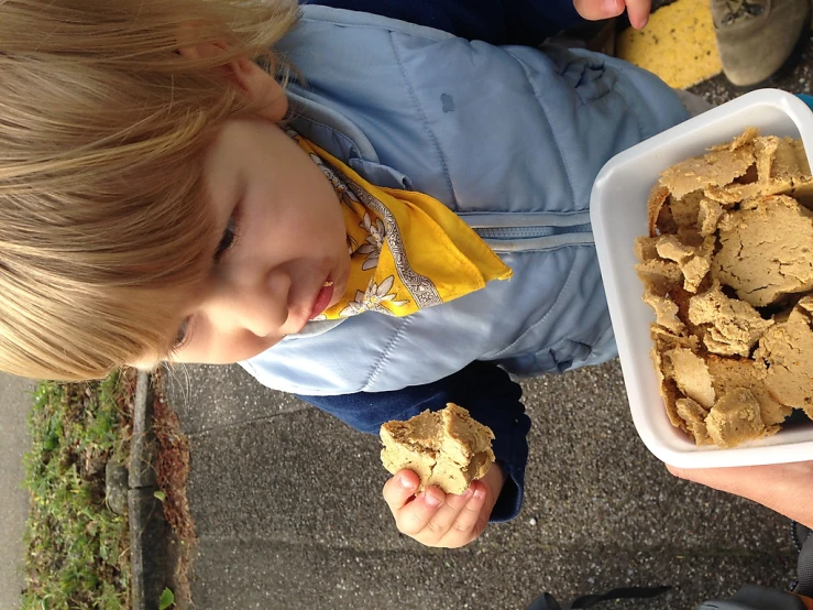 a toddler eating ice cream and peanut er