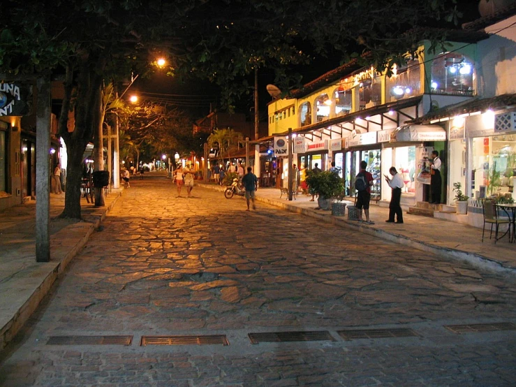 people are walking down the street in a city