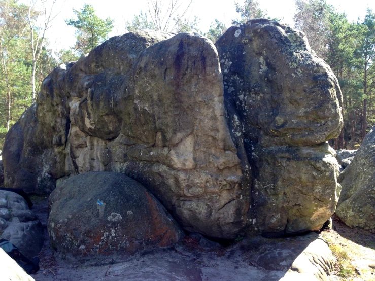 a couple of large rocks surrounded by some trees