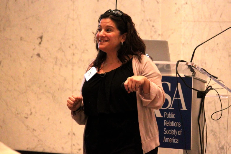 a person with a jacket on giving a speech