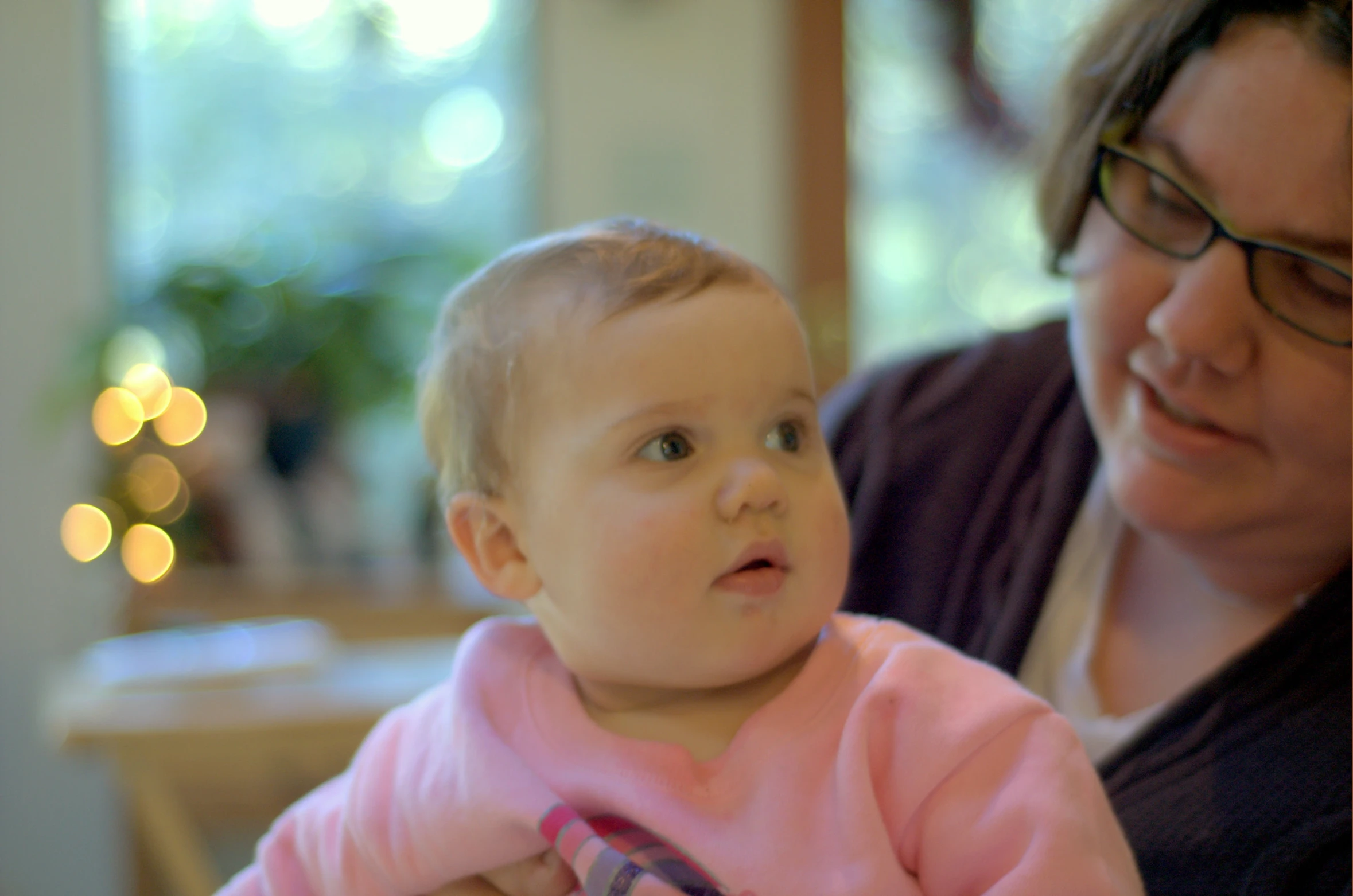 a woman and a child looking into the distance