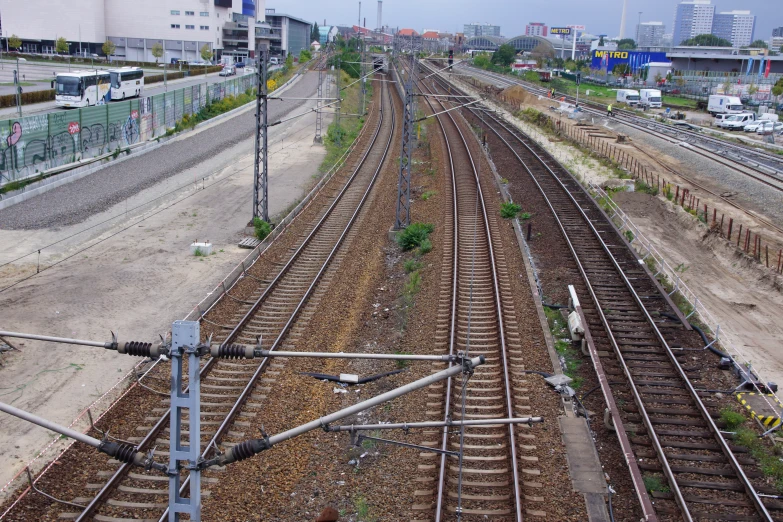 a very long train track on the side of the road