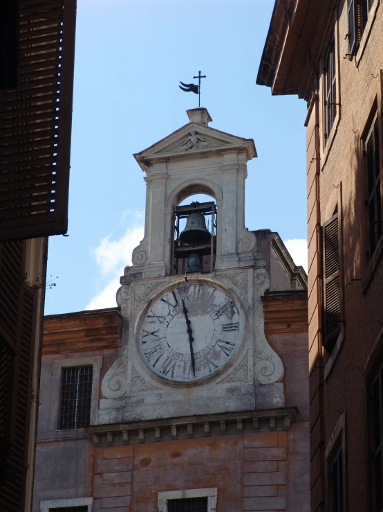 a tower with a clock on it next to a building