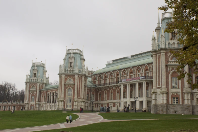 a couple of tall buildings with clocks on the tops of them