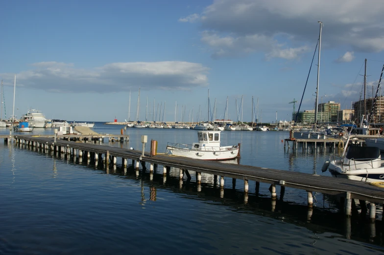 a group of boats are parked on the dock