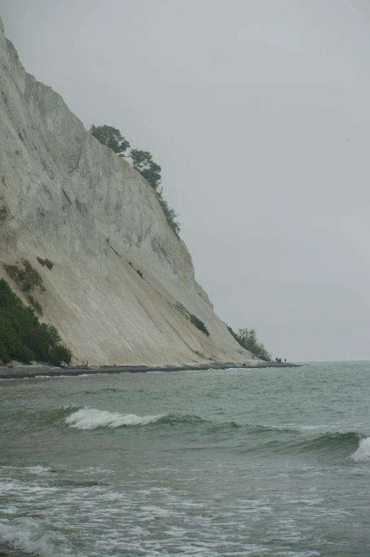 there is a view of the ocean and a large rock