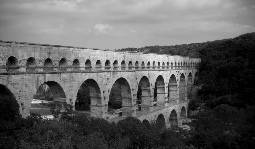 a black and white po of an old bridge