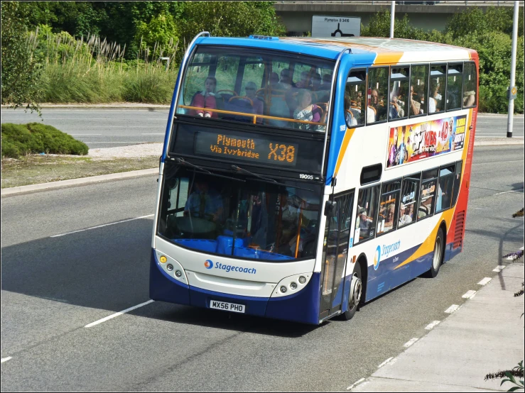 a double deck bus that has advertits on the side