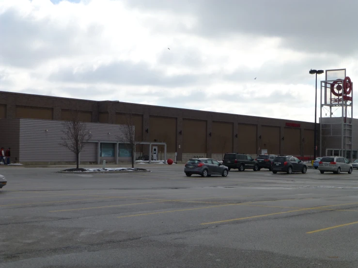 a building with lots of cars parked in front