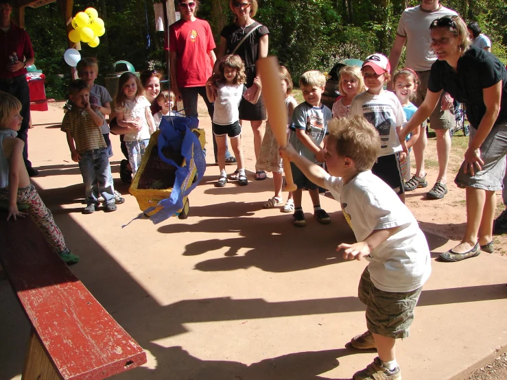 a small child on a skate board in a playground