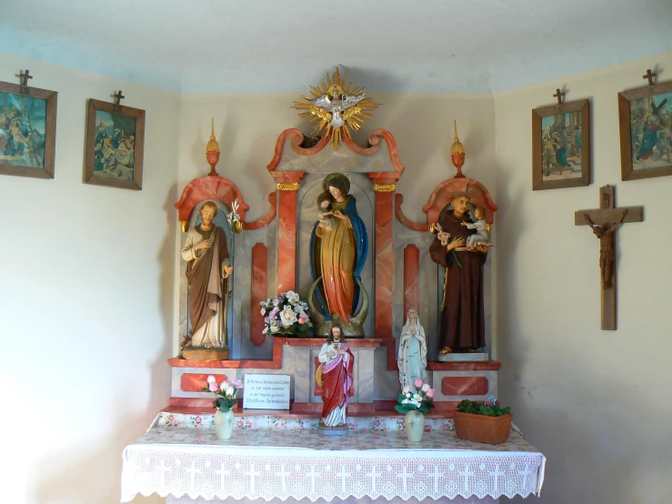 the altar is decorated with artwork from different countries