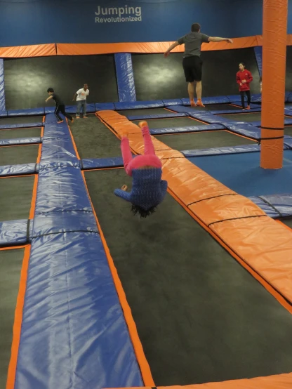 people playing with colorful obstacles in the gym