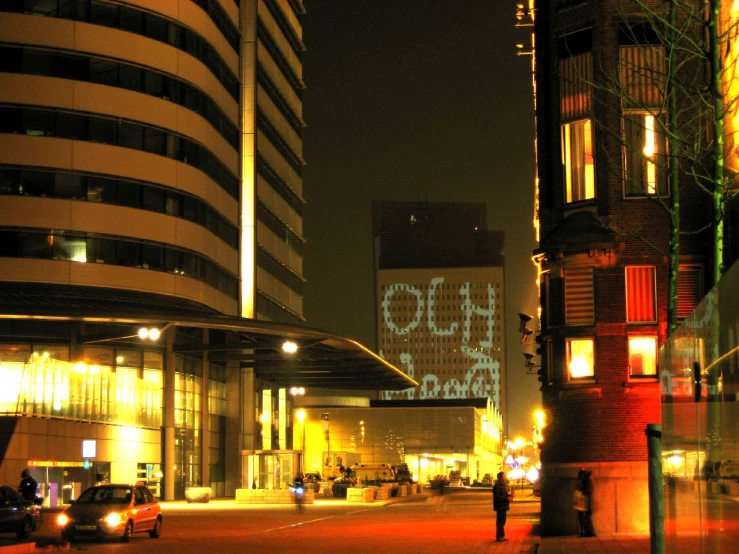 a street scene with the word go ahead lit up in yellow lights