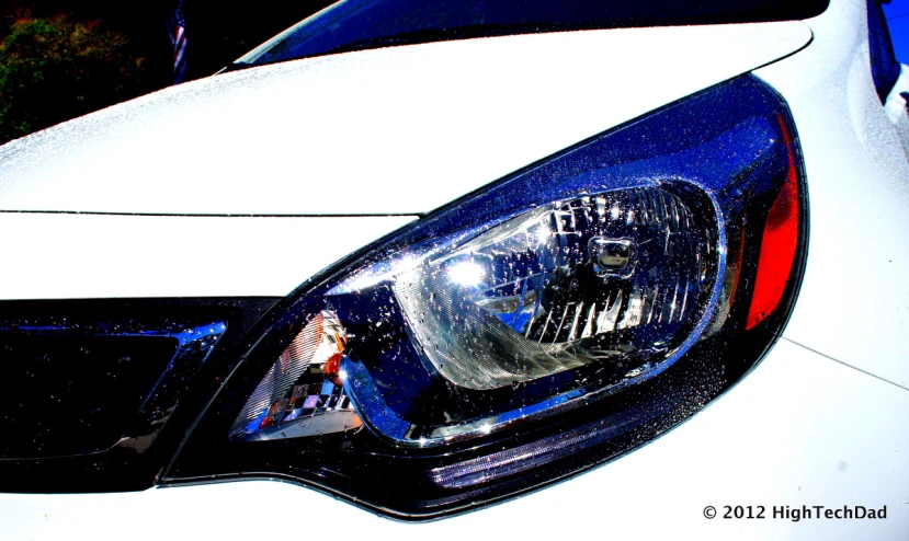 the front lights of a white sports car