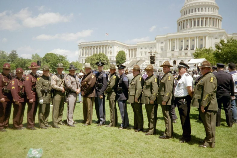 many police officers are standing in front of the capitol building