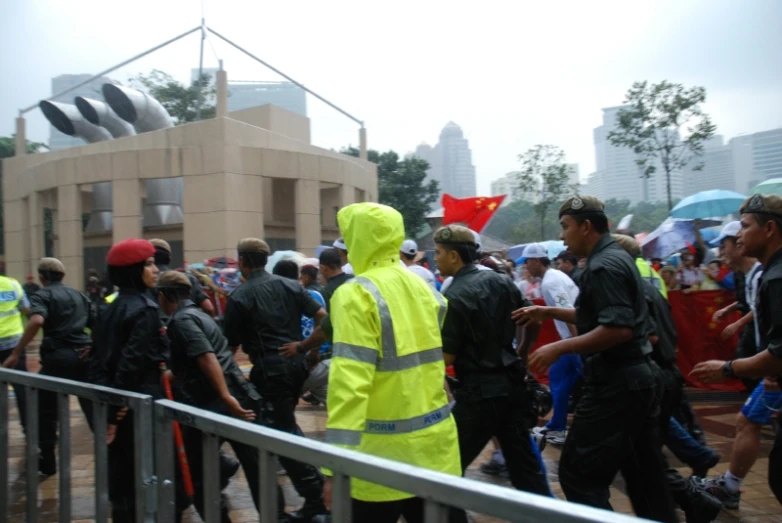 a group of people in rain gear walking together