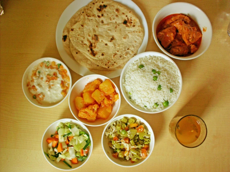 a table topped with bowls filled with different types of food