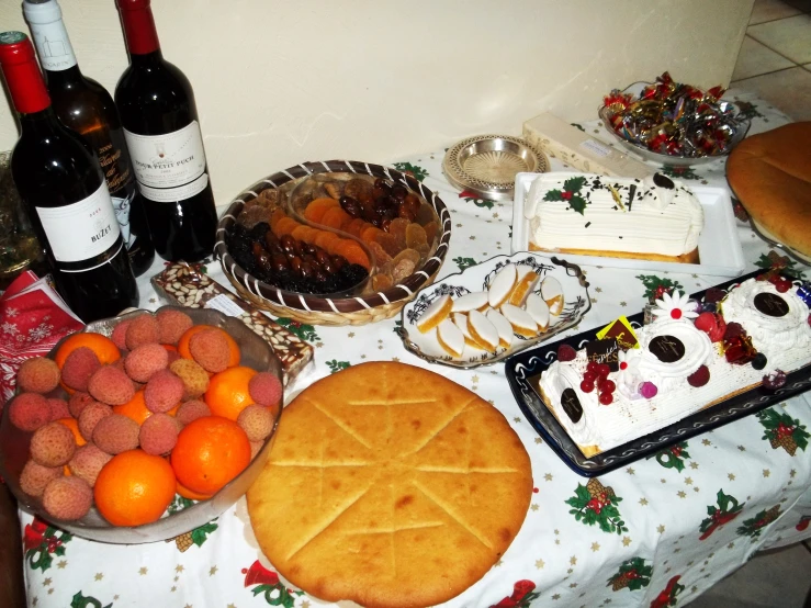 a table with some wine bottles and some cookies