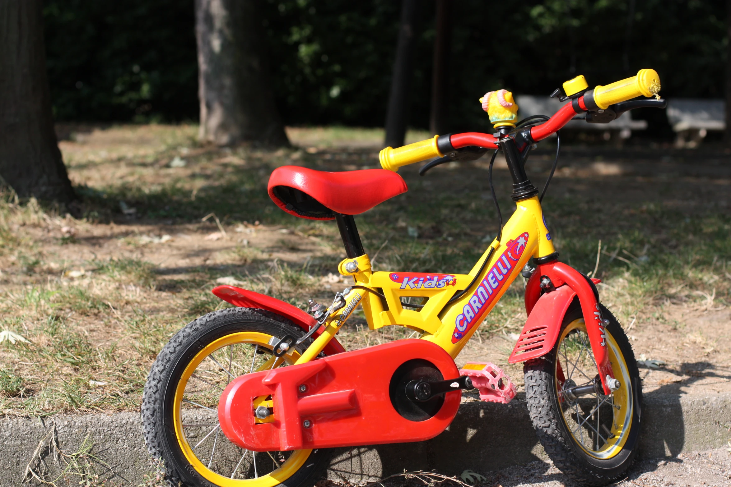 there is a small yellow and red bicycle