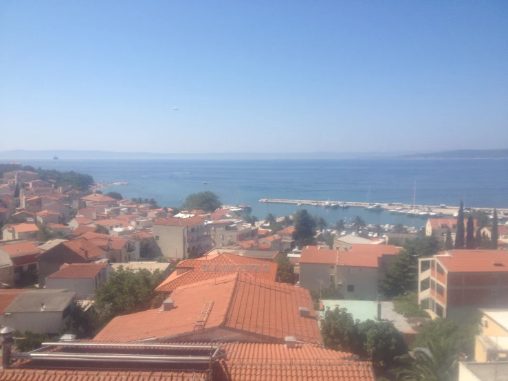 a city is covered with many orange roofs