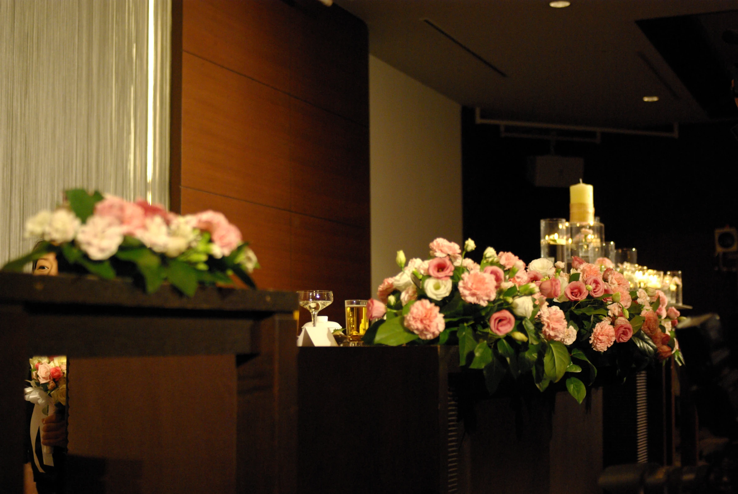 large, tall vases filled with pink and white flowers