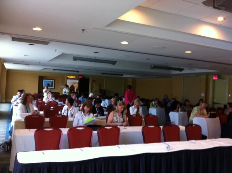 a large group of people in a conference room