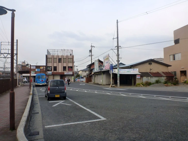 a car parked in the middle of an empty street