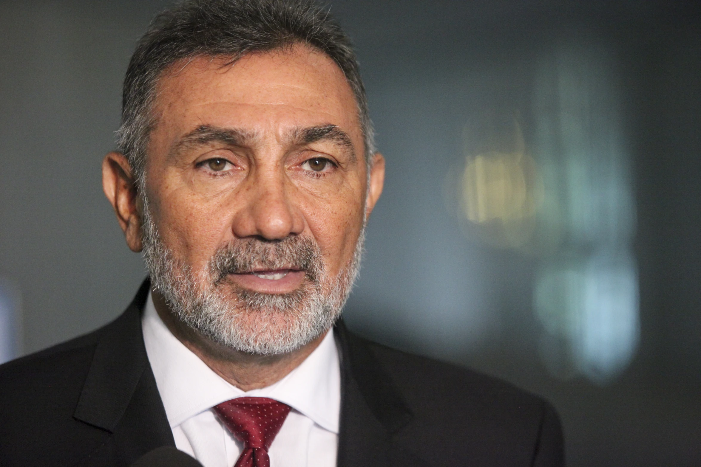 a close up of a man with grey hair