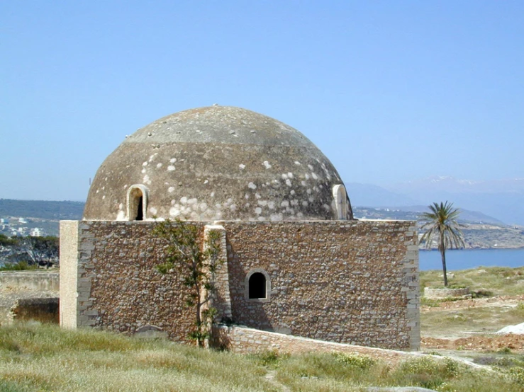 a large round building is on an island