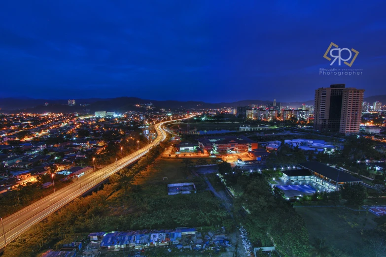 night time view of a city with lots of traffic and lights