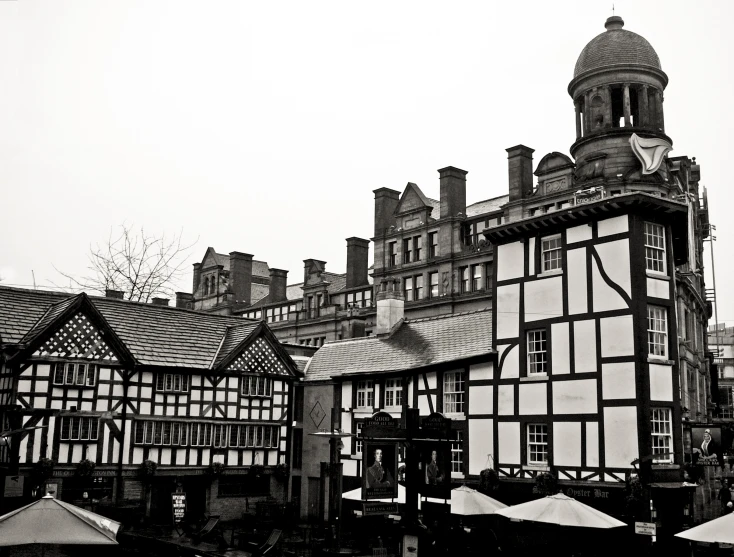 black and white pograph of buildings in the snow