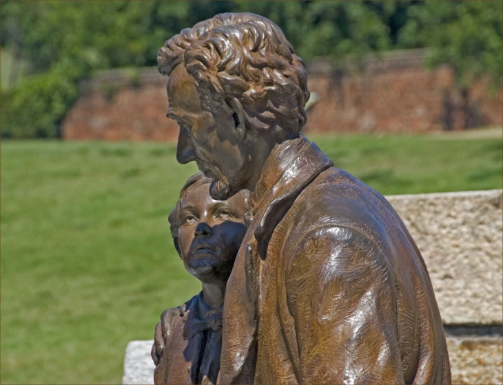 an image of statue of a man holding a baby