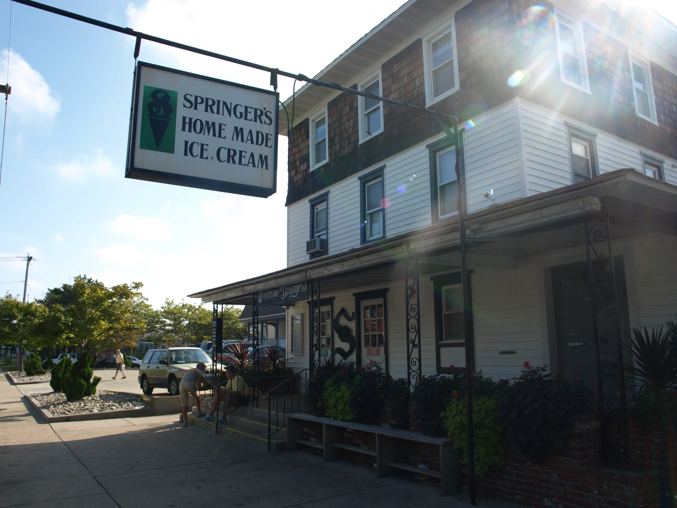 a store front with a white sign reading springers home market