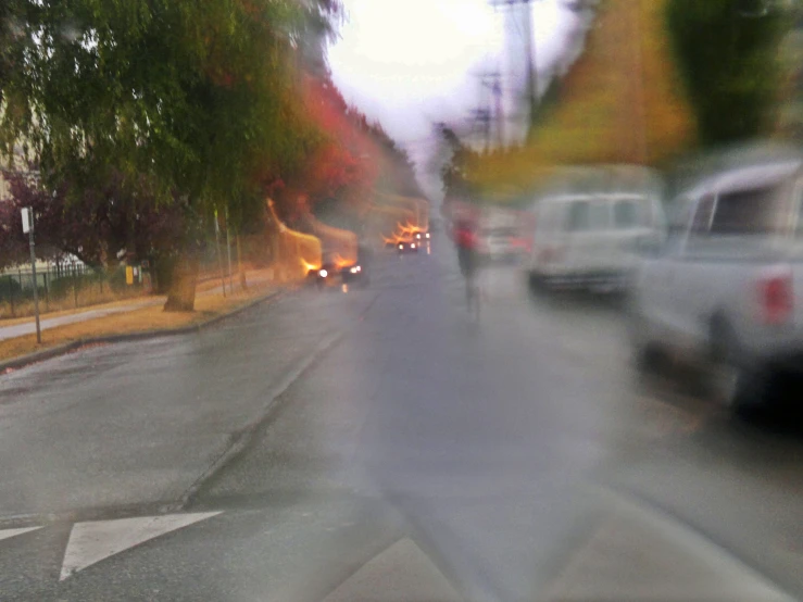 blurry image of traffic traveling down a street