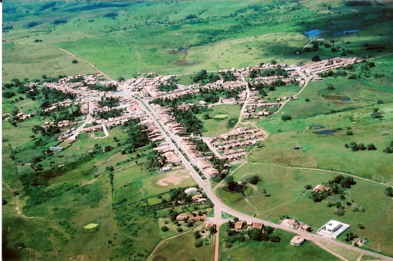 an aerial view of a town and its surrounding land